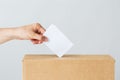 Man putting his vote into ballot box on election Royalty Free Stock Photo