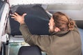 Man insulating the inside of his camper van