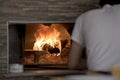 Man Putting Lahmacun Dough in to Hot Stone Oven With Wooden Pizza Peel Royalty Free Stock Photo