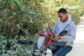 Man putting on a motorcycle helmet