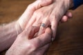 Man putting a ring on woman's finger Royalty Free Stock Photo