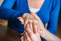 Man putting a ring on woman's finger Royalty Free Stock Photo