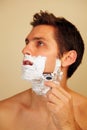 Man putting on shaving cream