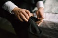 Man putting socks on his feet close-up in bedroom Royalty Free Stock Photo