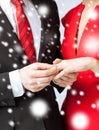 Man putting wedding ring on woman hand Royalty Free Stock Photo