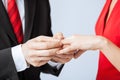 Man putting wedding ring on woman hand Royalty Free Stock Photo