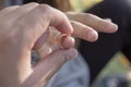 Man is putting wedding ring on woman`s finger Royalty Free Stock Photo