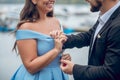 Man putting wedding ring on womans finger Royalty Free Stock Photo