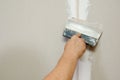 Man putty plasterboard Royalty Free Stock Photo