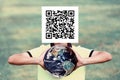 a man with a qr code on his face is holding the planet in his hands. Constraints concept. Image element used by NASA Royalty Free Stock Photo