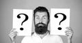 Man with question mark. Paper notes with question marks. Beard man question mark, solution problems. Thinking man with