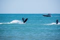 A man quickly rides a jet ski in the blue sea Royalty Free Stock Photo