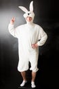 Man in a rabbit costume showing a peace sign