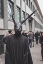 Man with rabbit mask outside Armani fashion show building for Mi