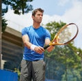 Man, racket and serve in outdoor tennis match, game and court for competition or practice. Male person, athlete and