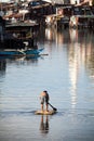 Man on raft - squatter shanty area Royalty Free Stock Photo