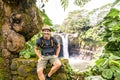 A man at The Rainbow Falls, Hilo, Wailuku River State Park, Big Island, Hawaii Royalty Free Stock Photo