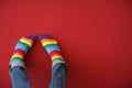 Man with rainbow socks on color background Royalty Free Stock Photo