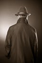 The man in a raincoat and a hat Royalty Free Stock Photo