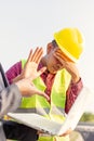 A man raise hands up for stop and give up..Foreman afraid manager at site construction