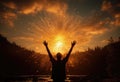 Man with raised hands against the setting sun Royalty Free Stock Photo