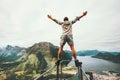 Man raised hands balancing at the edge cliff Royalty Free Stock Photo