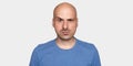 Man raised his eyebrow. Angry bald guy isolated Royalty Free Stock Photo