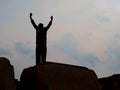 Man raising hand for cheer up silhouette