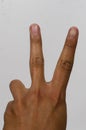 man raising two fingers up on hand it is shows peace strength fight or victory symbol Royalty Free Stock Photo