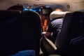 A man read book on the small private jet plane at the night under the light Royalty Free Stock Photo