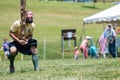 Man Readies To Perform Caber Toss At Scottish Highland Games