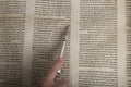 Man reading from an ancient torah scroll up close Royalty Free Stock Photo