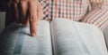 Man reading the bible pointing the text Royalty Free Stock Photo