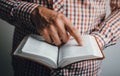 Man reading the bible pointing the text Royalty Free Stock Photo