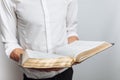 Man reading Bible, white background, book in hand close-up Royalty Free Stock Photo