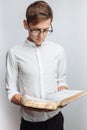 Man reading Bible, white background, book in hand close-up Royalty Free Stock Photo
