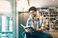 Man reading book in the library Royalty Free Stock Photo