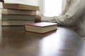 man reading book with textbook stack on wooden desk Royalty Free Stock Photo