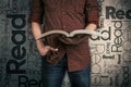 Man reading a book and the word Read on the background Royalty Free Stock Photo