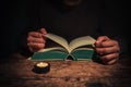 Man reading by candle light Royalty Free Stock Photo