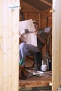 Man reading in garden shed Royalty Free Stock Photo