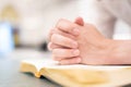 A man is reading the Holy Bible and praying in a worship room in a Christian church Royalty Free Stock Photo