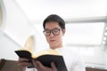 A man is reading the Holy Bible and praying in a worship room in a Christian church Royalty Free Stock Photo