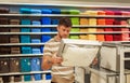 Man selecting bedclothes in shop