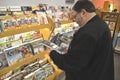 Man reading a magazine at a newstand in Annapolis, Maryland Royalty Free Stock Photo