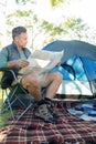 Man reading the map outside the tent Royalty Free Stock Photo