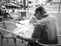 Man reading about Morandi Bridge collapse