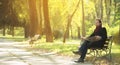 Man reading newpaper in the park