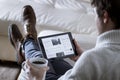 Man Reading News App on Tablet Royalty Free Stock Photo