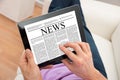 Man reading news on digital tablet Royalty Free Stock Photo